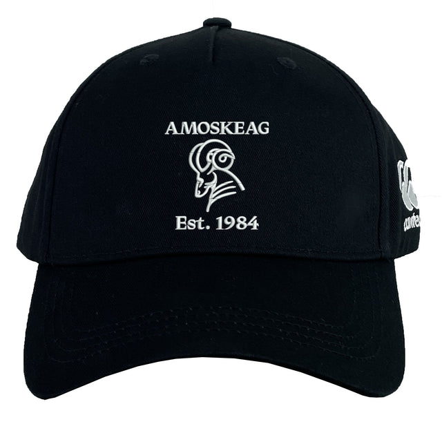 The Amoskeag Rugby Club Flexfit Drill Cap by EMB Canterbury features a black design with a white ram's head logo and "AMOSKEAG Est. 1984" embroidered on the front, offering a stylish custom cap for everyday wear.