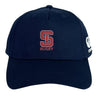 The St. Ignatius Rugby Flexfit Drill Cap by EMB Canterbury features a navy blue curved brim, red and white embroidered "S" and "RUGBY" text on the front, and a white Canterbury logo on the side.