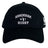 The Birmingham Rugby Text Logo Flexfit Drill Cap by Canterbury from EMB Canterbury showcases “Birmingham Rugby” along with small anvil, hammer, and rugby player icons embroidered in white on the front—a premium cap inspired by classic Canterbury style.