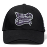 A black Valley Panthers Girls Rugby Flexfit Drill Cap by EMB Canterbury, featuring a purple and white “Valley Panthers Girls Rugby” logo on the front.