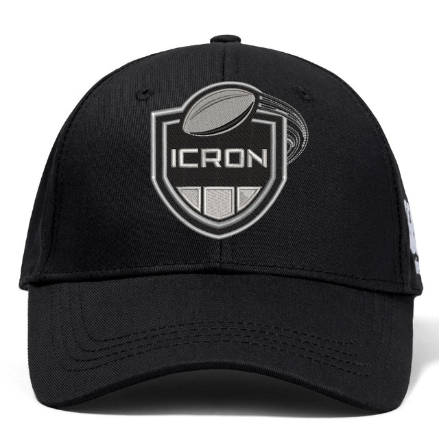 Black ICRON Flexfit Drill Cap by Canterbury with a curved brim and an embroidered shield emblem featuring a rugby ball and the word “ICRON.”