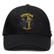 The Spartan Youth Rugby Flexfit Drill Cap by EMB Canterbury features a black design with a "Spartan Youth Rugby" logo and stylized black and yellow Spartan helmet, offering classic Canterbury comfort and style.