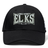 Introducing the Lewis County Elks Flexfit Drill Cap by EMB Canterbury—a classic black cap featuring a curved brim and “Lewis County Elks Rugby” embroidered on the front in white and gray lettering. Designed by Canterbury, this cap combines comfort and style for everyday wear.