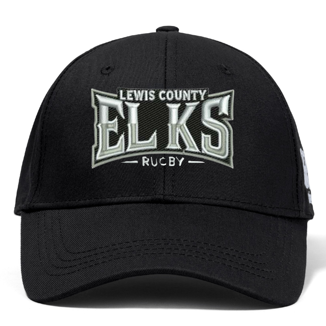 Introducing the Lewis County Elks Flexfit Drill Cap by EMB Canterbury—a classic black cap featuring a curved brim and “Lewis County Elks Rugby” embroidered on the front in white and gray lettering. Designed by Canterbury, this cap combines comfort and style for everyday wear.
