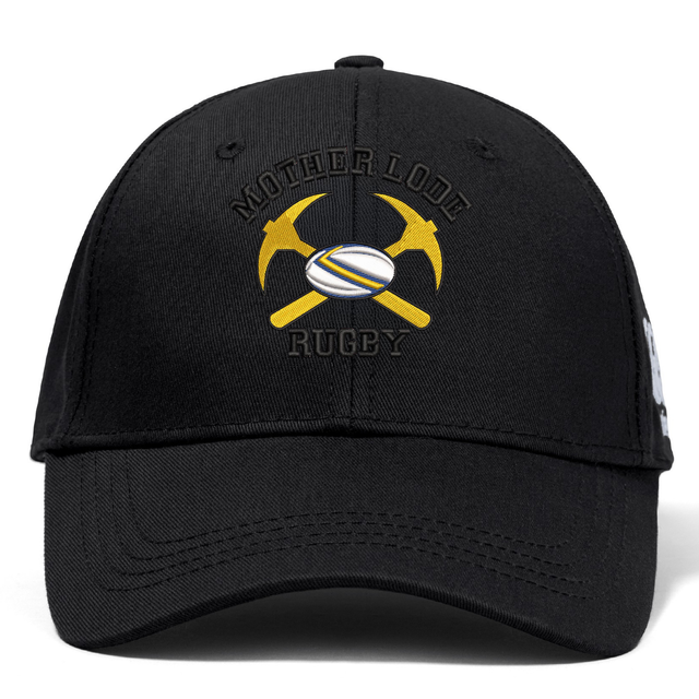 Black Mother Lode Flexfit Drill Cap by Canterbury featuring an embroidered logo of two crossed pickaxes with a rugby ball in the center and the text “MOTHER LODE RUGBY.”