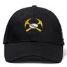 Black Mother Lode Flexfit Drill Cap by Canterbury featuring an embroidered logo of two crossed pickaxes with a rugby ball in the center and the text “MOTHER LODE RUGBY.”