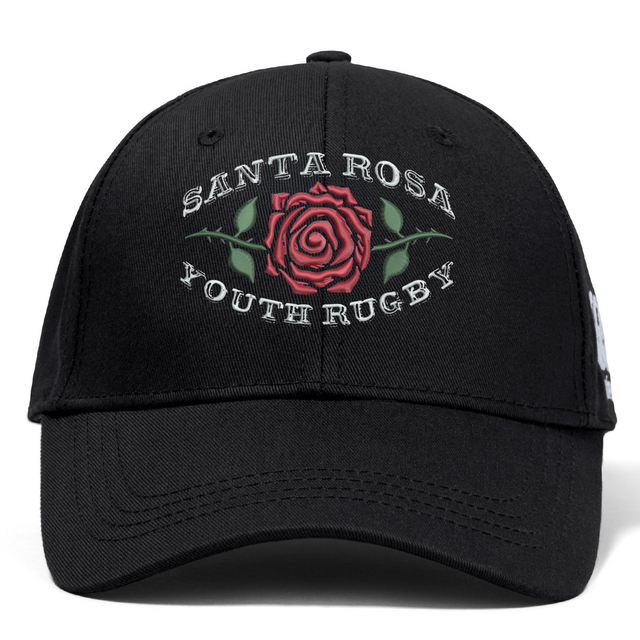 The Santa Rosa Youth Rugby Flexfit Drill Cap by Canterbury features a black curved brim and showcases “Santa Rosa Youth Rugby” text along with an embroidered red rose graphic on the front. Offered by EMB Canterbury, this classic CCC cap combines comfort and style, making it the perfect accessory for rugby fans.