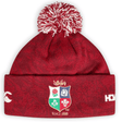 A British & Irish Lions 2025 Pom-Pom Beanie by Canterbury, featuring a red dahlia knit with a multicolored crest and the text "Since 1888.