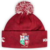 A British & Irish Lions 2025 Pom-Pom Beanie by Canterbury, featuring a red dahlia knit with a multicolored crest and the text "Since 1888.
