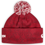 The British & Irish Lions 2025 Pom-Pom Beanie by Canterbury features a red knit design with a white pom-pom and subtle Canterbury text logos on the front, ideal for displaying your British & Irish Lions spirit.