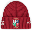 The British & Irish Lions 2025 Fleece Beanie by Canterbury is a red hat featuring an emblem with a lion, rose, thistle, and shamrock to honor the heritage of the British & Irish Lions. It includes "Since 1888" and white logos on each side, making it an ideal accessory for rugby fans.