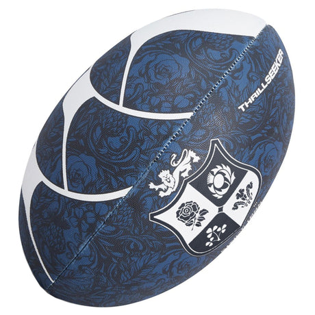 The British & Irish Lions 2025 Thrillseeker Supporters Ball by Canterbury features a blue and white floral design and is equipped with a rugby grip for improved control. It proudly showcases a logo featuring a lion, rose, and thistle on the side, alongside BIL branding for dedicated fans.