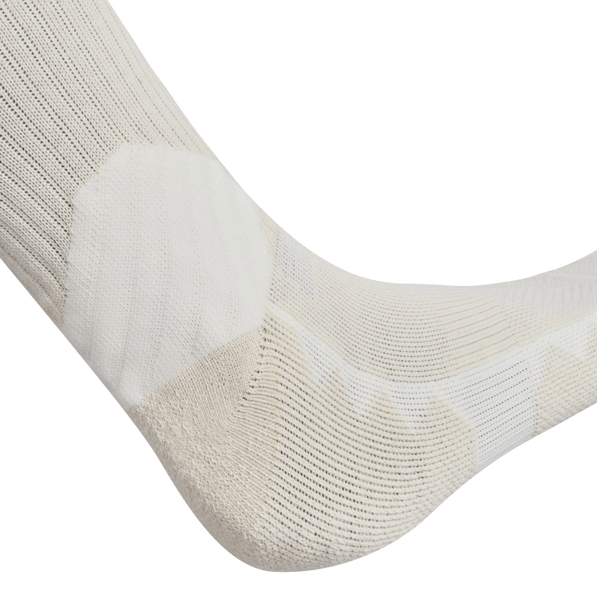 Close-up of a beige and white British & Irish Lions 25 Crew Training Sock by Canterbury, featuring geometric patterns on a foot, highlighting detailed stitching and texture.