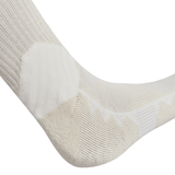 Close-up of a beige and white British & Irish Lions 25 Crew Training Sock by Canterbury, featuring geometric patterns on a foot, highlighting detailed stitching and texture.