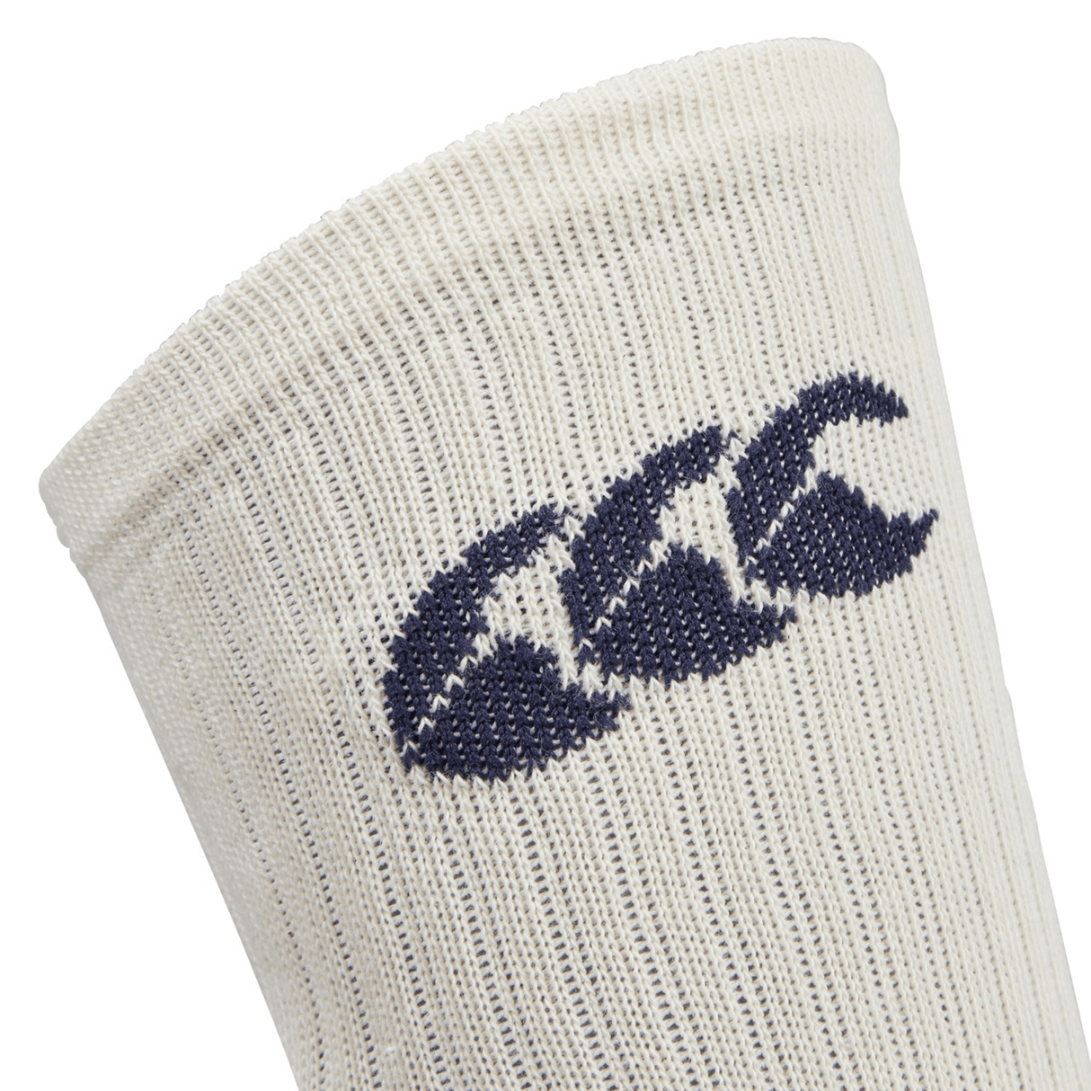 Close-up of the upper section of a cream-colored British & Irish Lions 25 Crew Training Sock by Canterbury, showcasing a stitched blue logo with three stylized figures.
