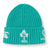 The Ireland 26 Beanie by Canterbury is a teal ribbed knit hat featuring embroidered white logos, including a shamrock rugby emblem and “IRFU” text on the folded brim.