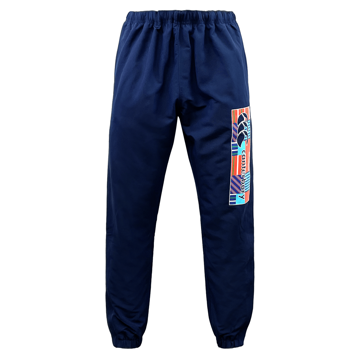 The Canterbury CCC Uglies Tapered Cuff Stadium Pant - Peacoat, featuring an elastic waistband and cuffs, offers both style and comfort with its colorful geometric design on the left leg and prominent Canterbury branding.