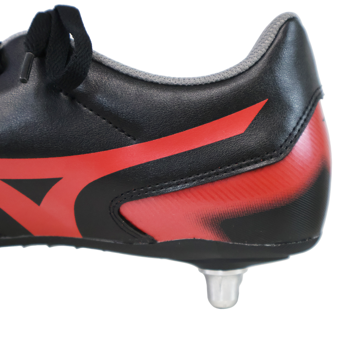 Close-up of the heel and side of the Mizuno Waitangi II CL SG rugby boot in Black/Morelia 40th Anniversary Red, featuring a metallic stud. Brand: Mizuno. Set against a plain white background.