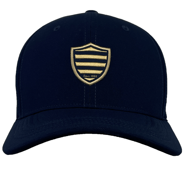 A black Racing 92 Classic 99 Cap by Nike with a gold shield and striped emblem on the front center, featuring sweat-wicking fabric for all-day comfort.