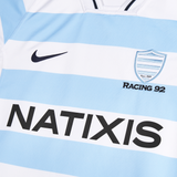 Close-up of the Racing 92 25/26 Replica Home Jersey by Nike in light blue and white stripes, featuring the club crest and "NATIXIS" sponsor—a must-have for Racing 92 fans.