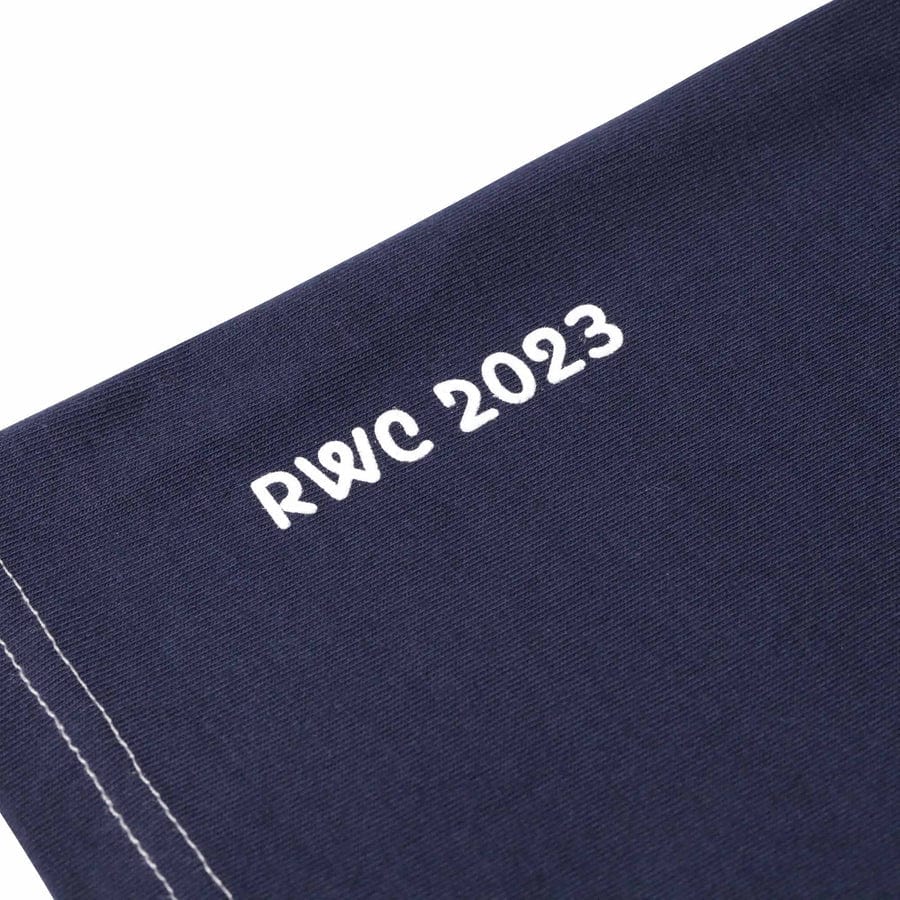 Detail of the RWC2023 logo and white stitching on the navy shirt.