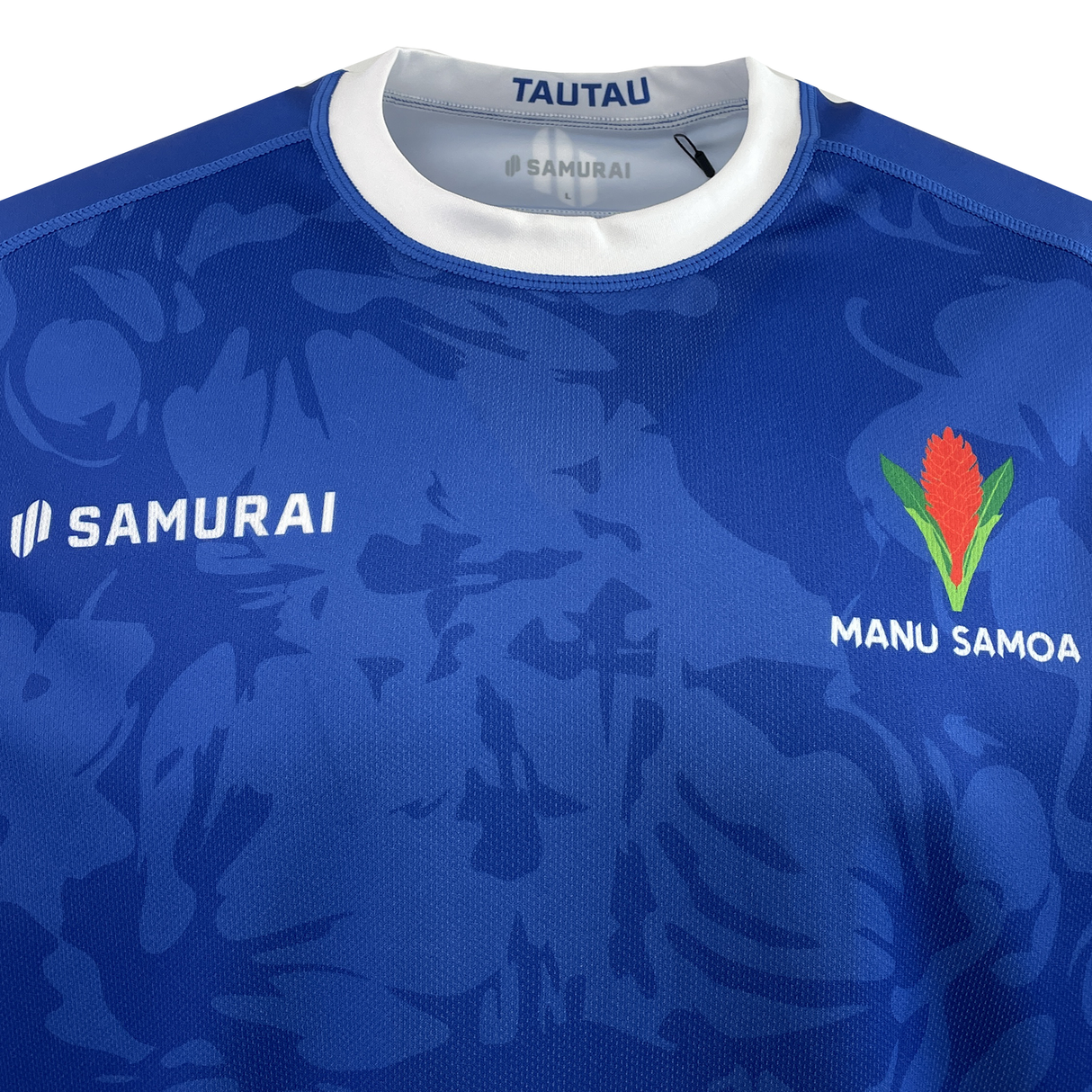 Check out the Samoa 100 Year Celebration Premium Replica Jersey by Samurai in striking blue, adorned with "SAMURAI" and "MANU SAMOA." The chest showcases a bold red and green emblem, embodying the vibrant spirit of Samoa's dynamic team.