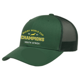 A South Africa RWC 23 Champions Retro Trucker Cap with the word "champions" on it by EMB Alpha Broder.