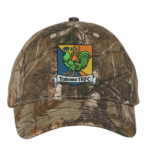 Takoma Touch Rugby Realtree Camo Cap in Realtree Xtra camouflage, featuring a shield crest with a green rooster knight and the text “Takoma TRFC” on a banner.