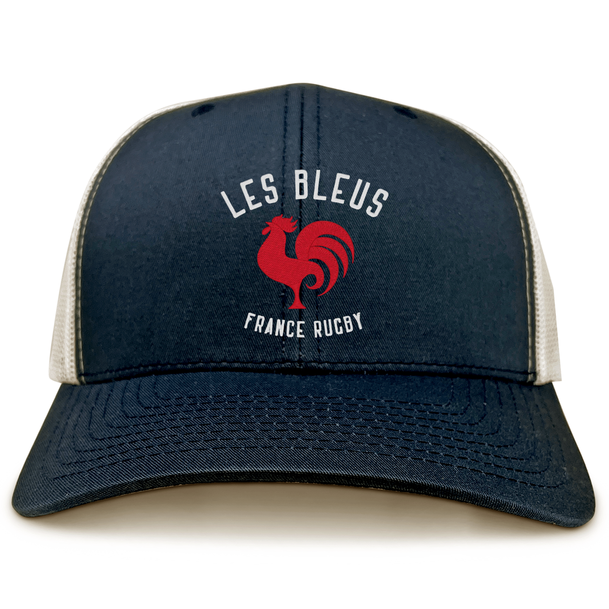 The Les Bleus France Rugby Retro Trucker Cap by EMB S&S Activewear features a bold red rooster graphic and “LES BLEUS” and “FRANCE RUGBY” text on navy blue and beige, perfect for France Rugby fans.