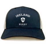 The EMB S&S Activewear Nations of Rugby Ireland Retro Trucker Cap features navy and white mesh, a printed "Ireland Rugby" logo, and a shamrock crest—ideal for any rugby fan.