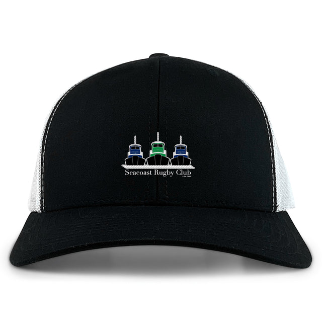 The Seacoast Rugby Club Retro Trucker Cap by EMB S&S Activewear features a black and white design, three stylized boats, club embroidery on the front, and an adjustable snapback closure for a perfect fit.