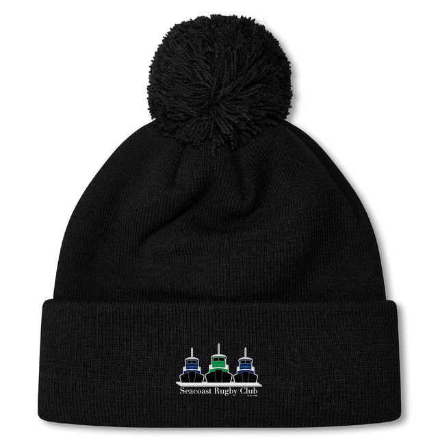 Stay warm on chilly match days with the Seacoast Rugby Club Pom Pom Beanie by EMB Canterbury—featuring a fleece lining, pom-pom, and an embroidered three ships logo with "Seacoast Rugby Club" on the front cuff.