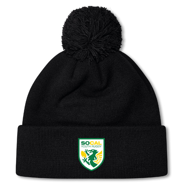 Stay warm in the EMB Canterbury SoCal Youth Rugby Pom Pom Beanie by Canterbury, a black fleece-lined knit hat with a pom-pom and SoCal Youth Rugby logo patch—perfect for rugby fans.