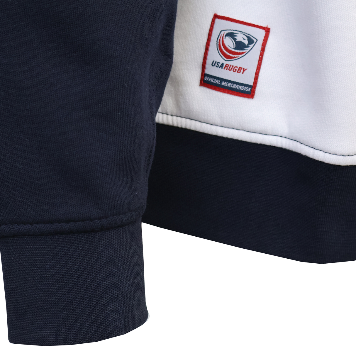 Close-up of the SDS USA Rugby Rugger Sweater in navy blue and white, featuring an official merchandise patch—ideal for fans of American rugby apparel.