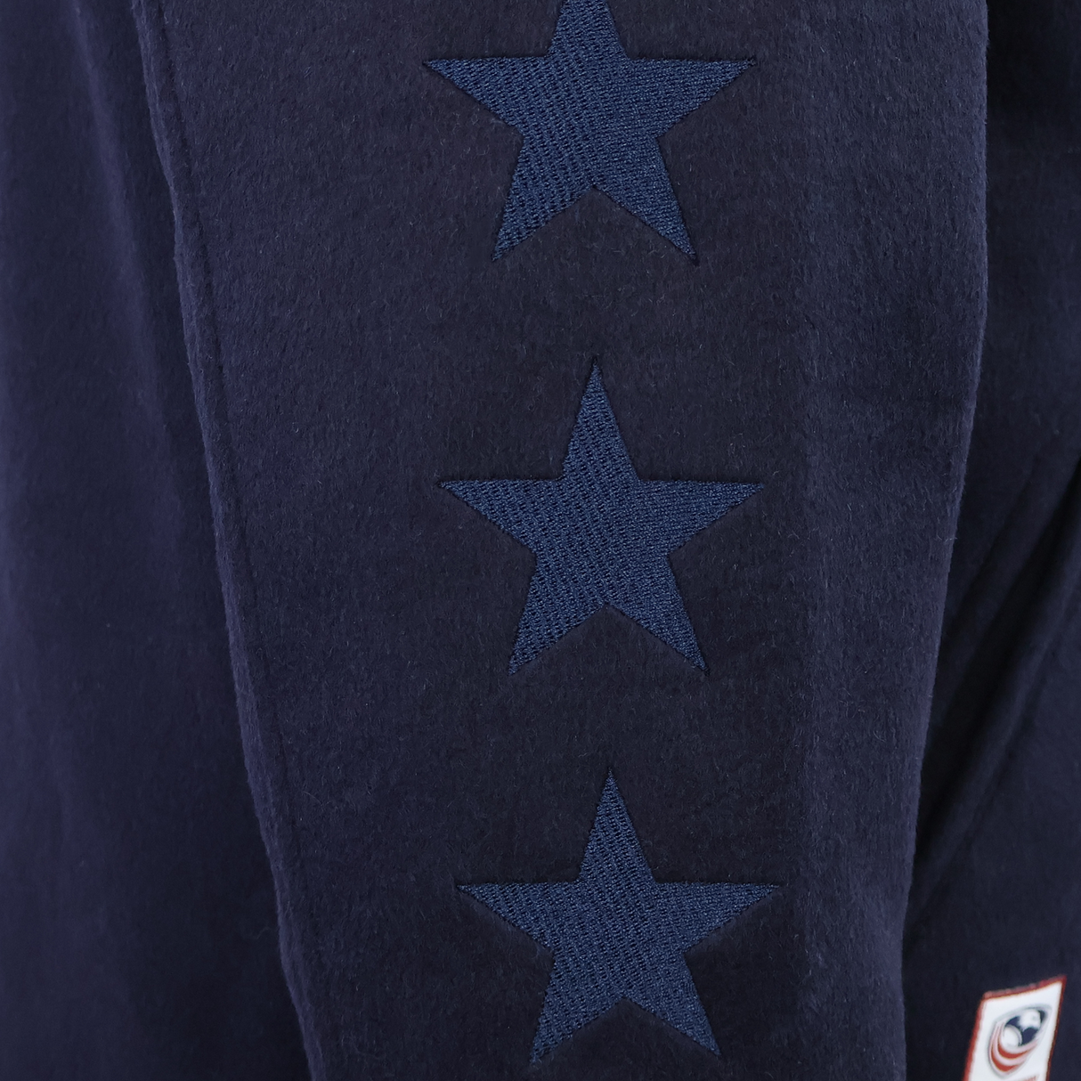 Close-up of the SDS USA Rugby Varsity Wool Jacket in dark blue wool, featuring three vertically aligned dark blue stars.