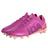 A pair of IDA Helia Club SG women's soccer boots by IDA Sports in dark pink with orange accents and bold black branding on the side.
