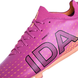 Close-up of the IDA Helia Club SG - Dark Pink by IDA Sports, a women's soft ground soccer boot with purple laces, bold "IDA" branding, and a geometric pattern—ideal for players seeking stylish soccer cleats.