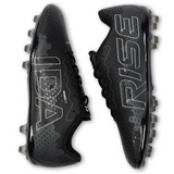 The Ida Women's Rise Club FG "Stronger Together" cleats from IDA Sports feature vegan black leather with large white text—"IDA" on the left shoe and "RISE" on the right. Crafted for women, these adjustable cleats ensure maximum comfort and performance on the field.