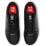 Top view of the Ida Women's Rise Club FG "Stronger Together" black sports shoes by IDA Sports, made from vegan leather with black laces, adjustable fit, and featuring a red insole with "IDA" and a stylized logo.