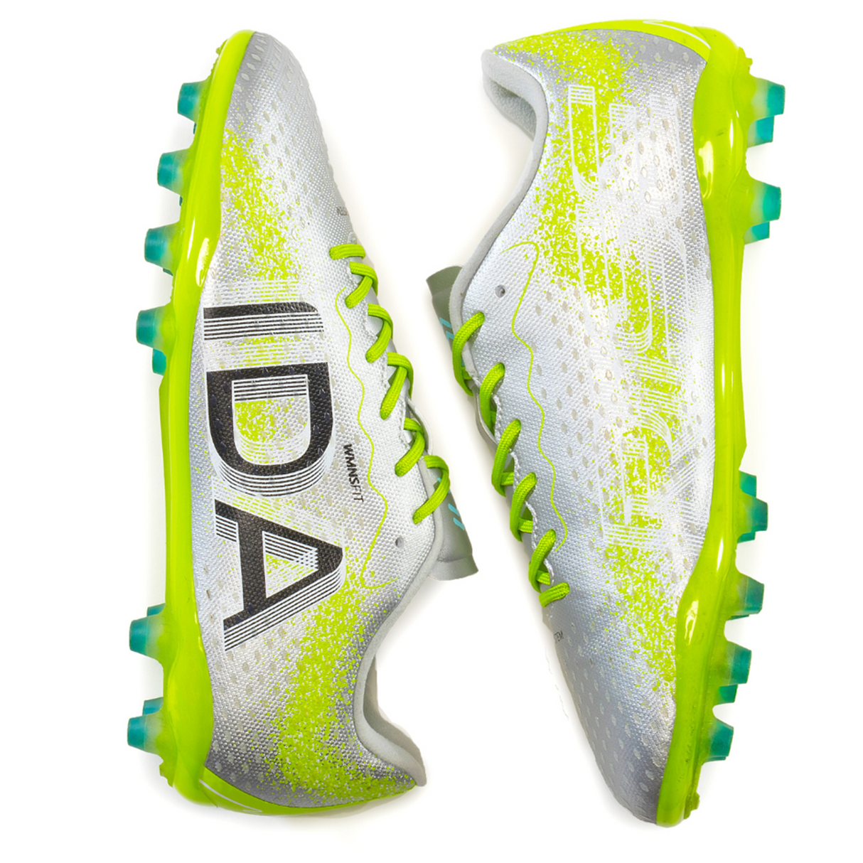 Ida Women's Rise Club FG "Play All Day" cleats by IDA Sports feature silver and neon green colors with "IDA" prominently displayed on the side, crafted from vegan leather for an eco-friendly touch.