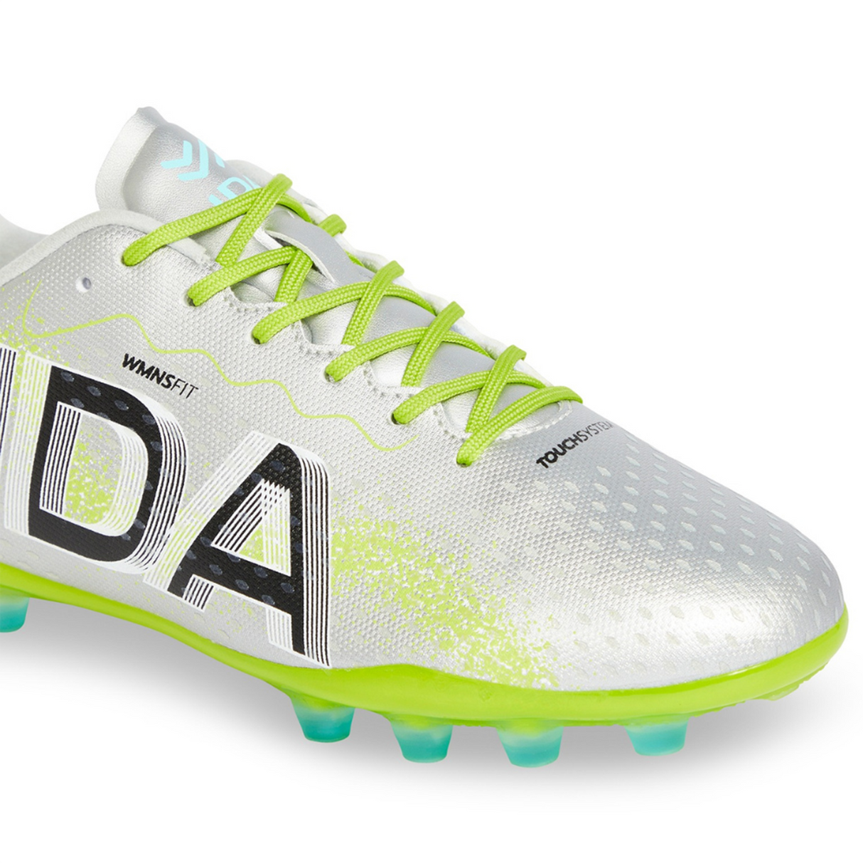 The Ida Women's Rise Club FG "Play All Day" by IDA Sports is a silver firm ground cleat with lime green laces, a neon green sole, and crafted from vegan leather. It has text and logo designs on the side.