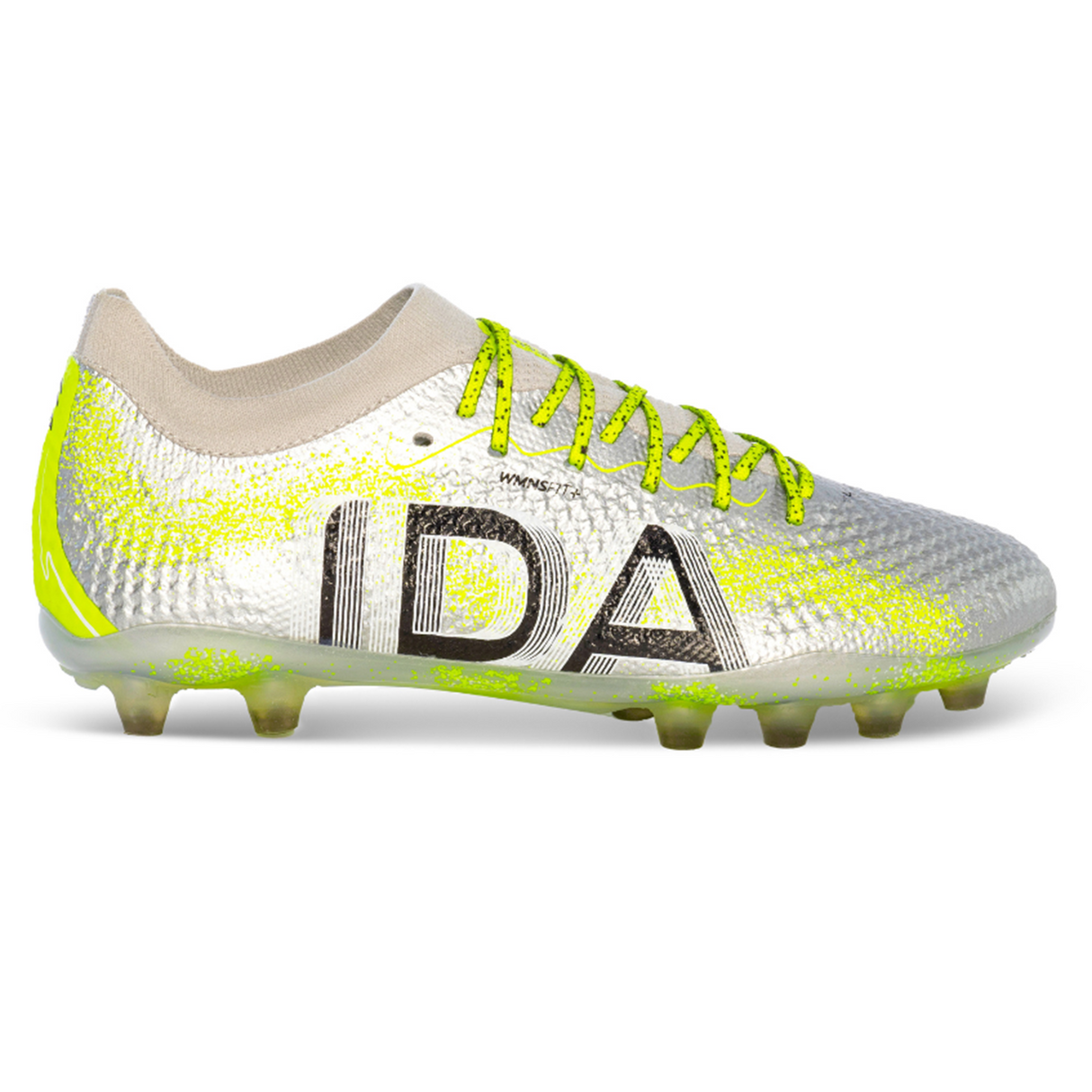 The Ida Women's Rise Elite FG "Play All Day" by IDA Sports is a silver cleat with neon yellow accents and bold "IDA" on the side. Crafted with WAVEKNIT technology, it’s 100% vegan, ensuring top performance and sustainability on the field.