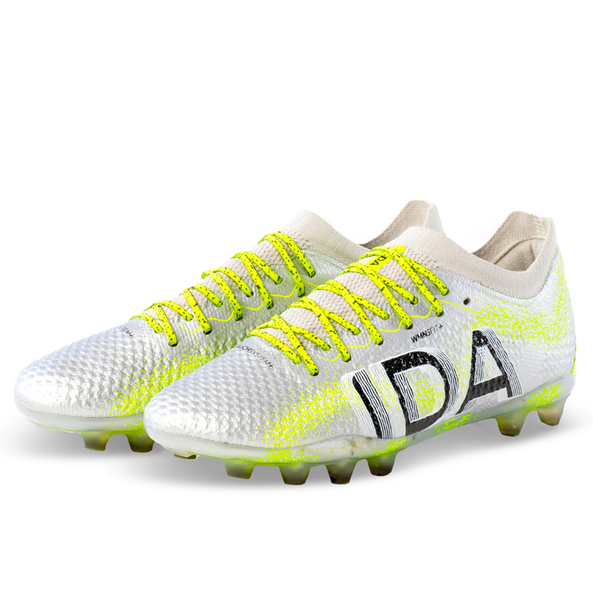 The IDA Sports Ida Women's Rise Elite FG "Play All Day" cleats in silver/green are 100% vegan, feature neon yellow laces with "IDA" on the side, and showcase crafted precision.