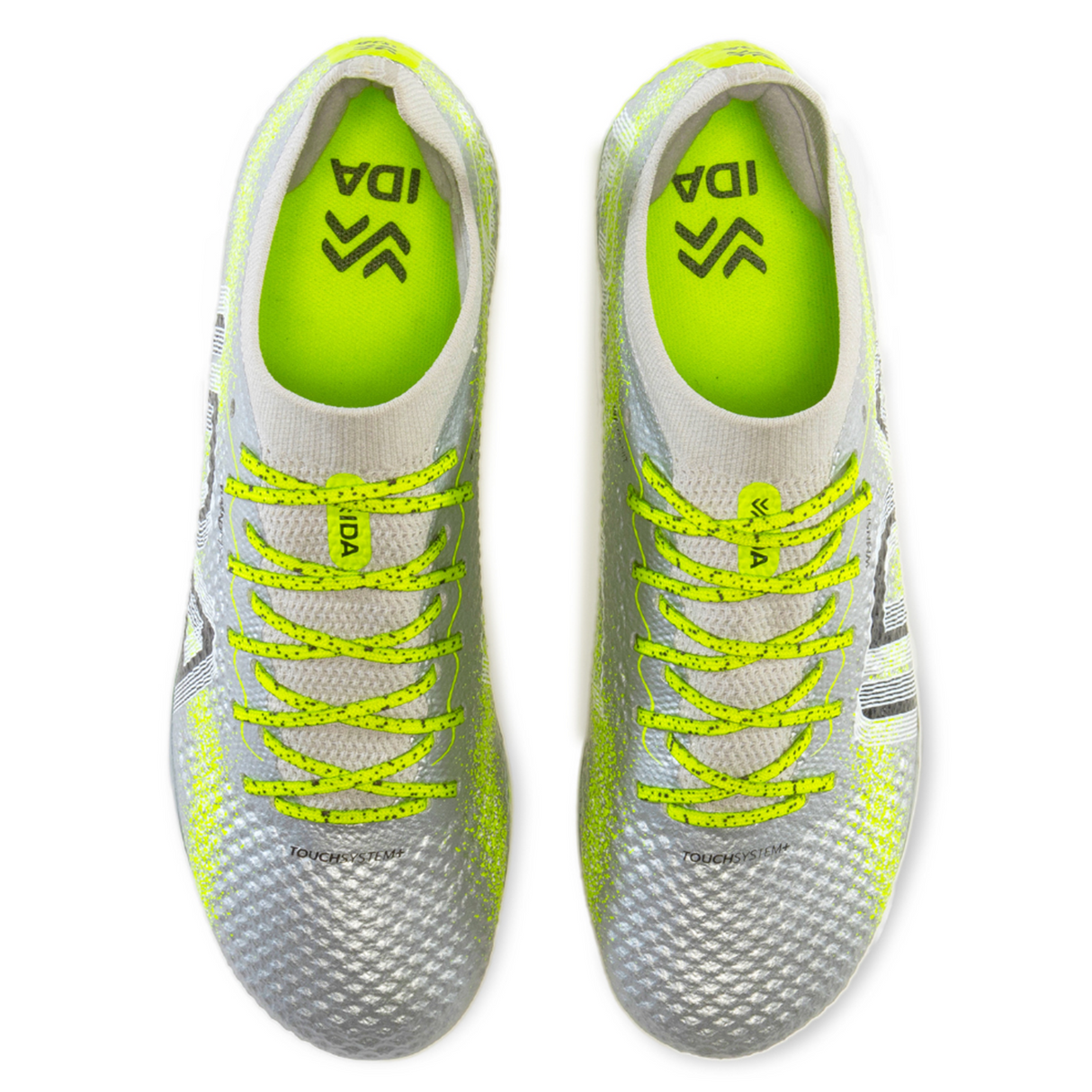 Top view of IDA Sports Ida Women's Rise Elite FG "Play All Day" soccer cleats in silver/green featuring WAVEKNIT technology, textured surfaces, and lime green laces.