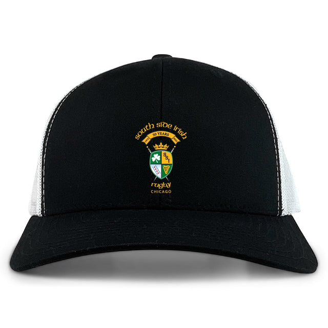 The South Side Irish 50th Anniversary Retro Trucker Cap by EMB S&S Activewear features an embroidered Chicago crest, "50 Years" front text, classic black and white design, and a snapback closure.