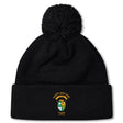 The South Side Irish 50th Anniversary Pom Pom Beanie by EMB Canterbury features a black knit, fleece lining for warmth, a large pom-pom, and an embroidered South Side Irish Rugby Chicago crest on the front cuff.