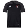 The black Superior Rugby Vapodri Evader Jersey by EMB Canterbury features a white logo, a red and white "S" team crest, and moisture-wicking fabric to keep you cool and comfortable throughout every game.