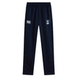 The EMB Canterbury Eckerd College Stretch Tapered Pant features navy blue fabric, an elastic waistband, two white thigh logos, and quick-dry material for comfort and flexibility during any activity.