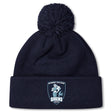 The Eckerd College Pom Pom Beanie by Canterbury, from EMB Canterbury, is a navy blue rugby hat with a fleece-lined interior, front cuff logo patch, and pom-pom on top.