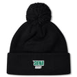 A black EMB Canterbury beanie, featuring a cozy fleece lining and pom-pom, displays "Siena" and "Rugby" in green and white text on its folded brim.